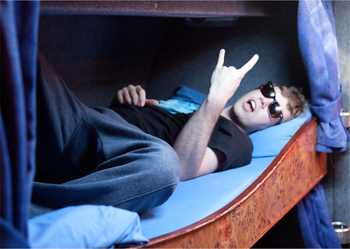 James relaxing in his bunk on the bus